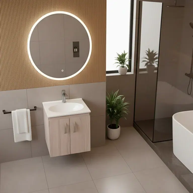 Lavamanos en mármol sintético empotrado tipo vanity de la marca Firplak instalado sobre un mueble de madera en un baño moderno con tina, ideal para proyectos de remodelación residencial de lujo.